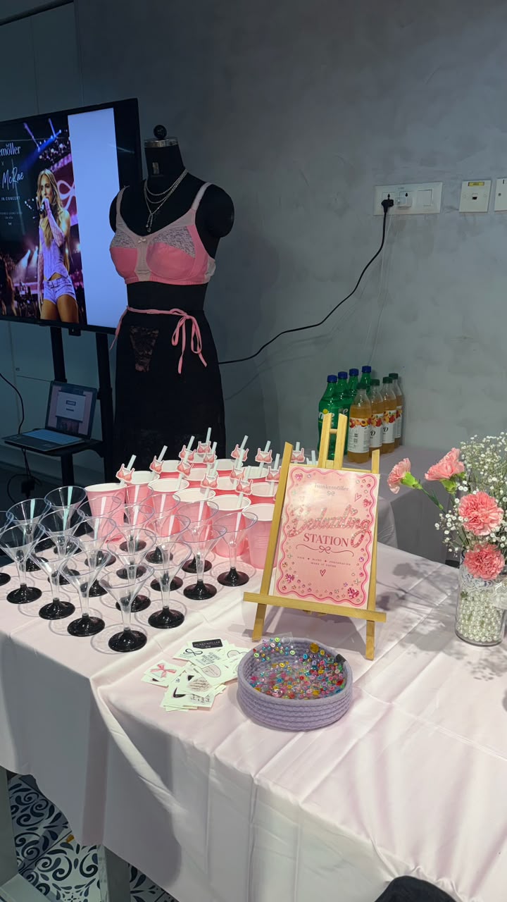 The activation set: a styled mannequin in Hunkemöller lingerie beside a screen, with the drinks and bedazzling table laid out in front.